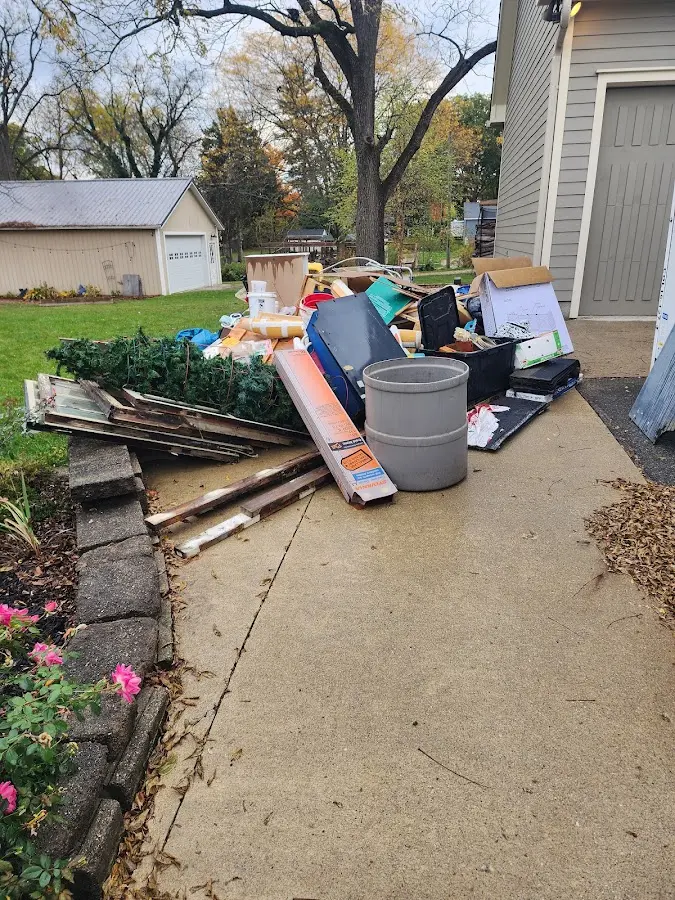 Dumpster being loaded with debris for Demolition Dumpster Rental in South Kingstown